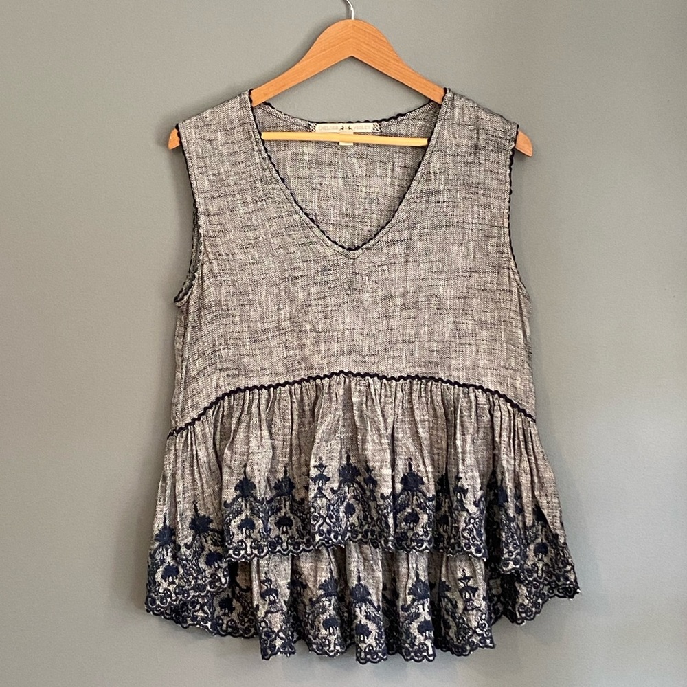 Sleeveless V-Neck Back Drop Hem Top